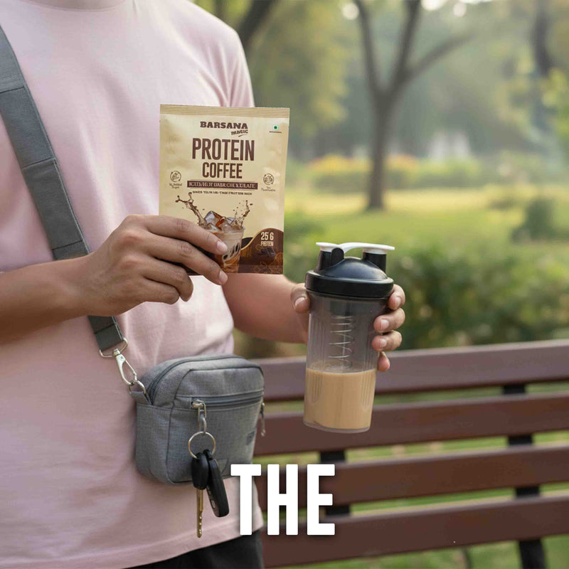Barsana Magic and Person holding a protein coffee package and a shaker with a green park background