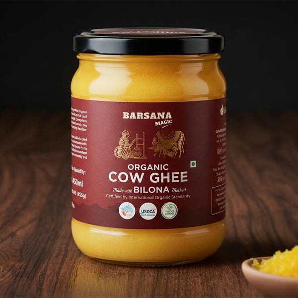 Barsana Magic and Jar of Organic Cow Ghee on a wooden surface with a dark background