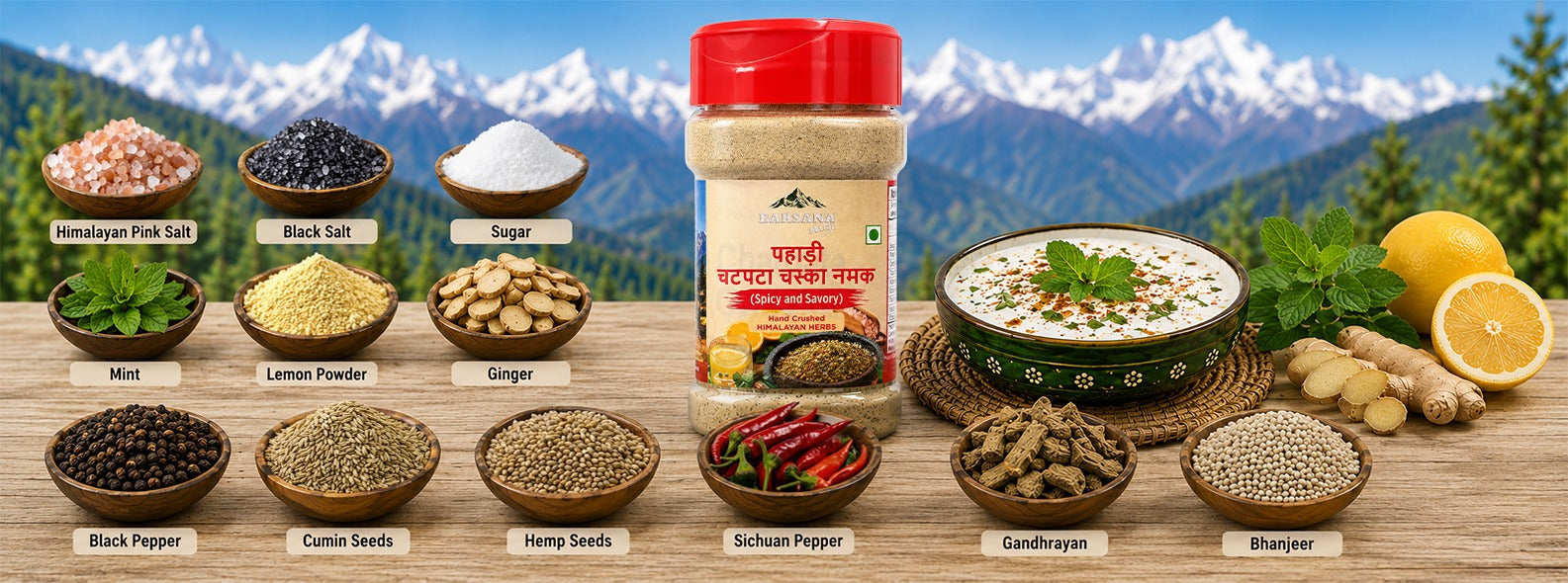 Barsana Magic and A spice blend jar labeled 'Mehndi Masala' is centered on a wooden surface, surrounded by labeled bowls of its ingredients including pink salt, black salt, sugar, mint, lemon powder, ginger, black pepper, cumin seeds, hemp seeds, schum pepper, sandhogyo, and bharjee. A bowl of prepared food and lemons appear on the right, with a mountain landscape backdrop behind.