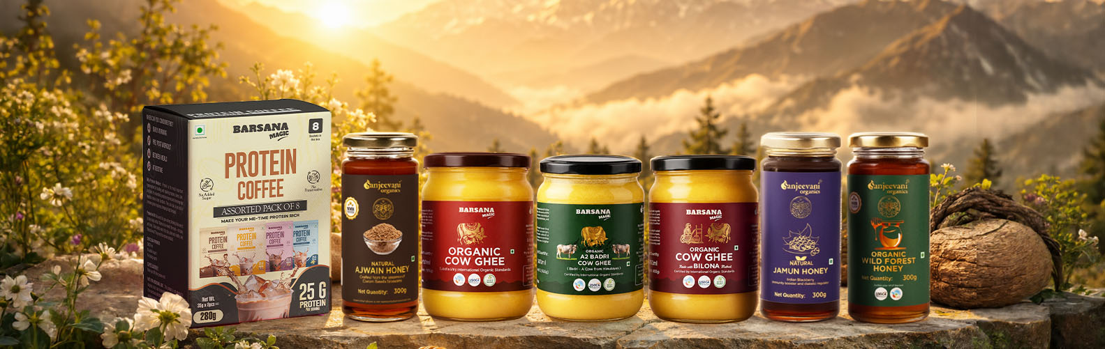 Barsana Magic and Assorted coffee products on a wooden surface with a scenic mountain background