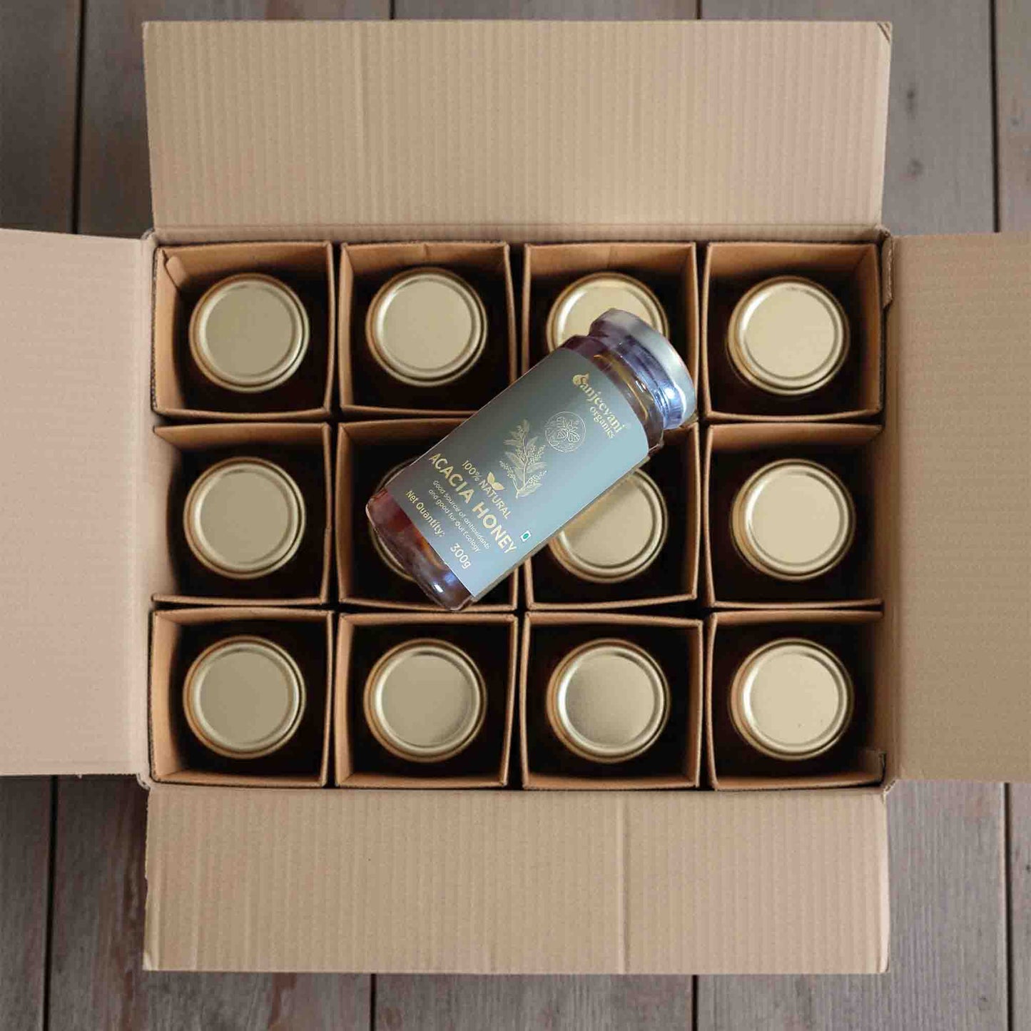Barsana Magic and Box of jars with a bottle on a wooden surface
