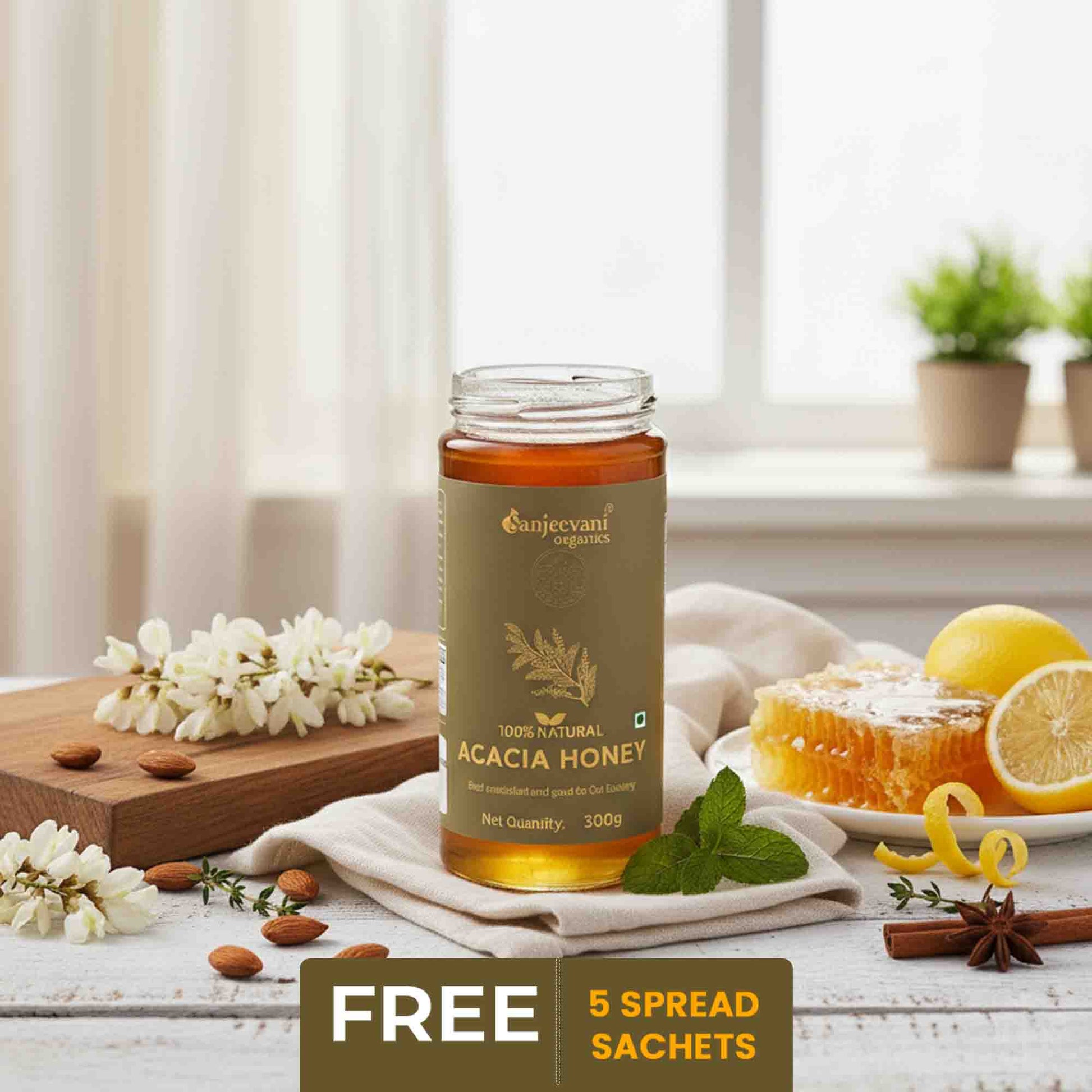 Barsana Magic and  Bottle of Sanjeevani Acacia Honey on a table with lemons, flowers, and a window in the background.