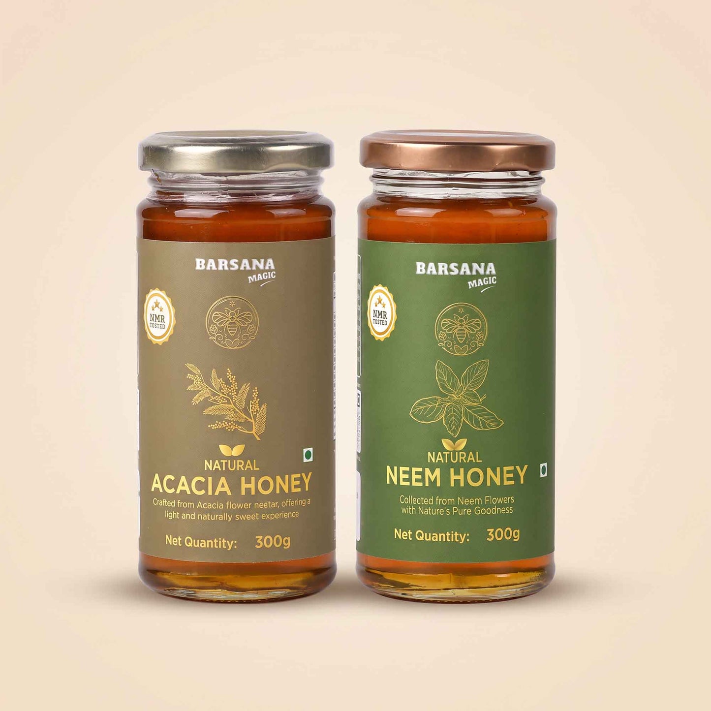 Barsana Magic and Two glass jars of Barsana Magic honey, Natural Acacia Honey on the left with a brown label and silver lid, and Natural Neem Honey on the right with a green label and bronze lid, set against a solid beige background.
