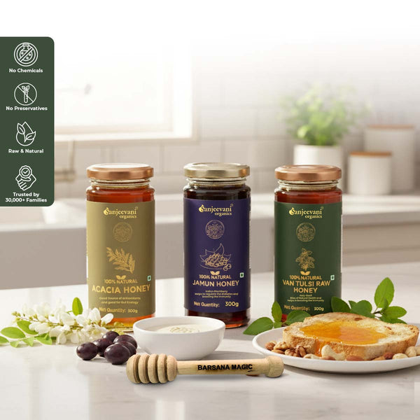 Barsana Magic and Three jars of honey with labels on a kitchen counter, featuring natural and organic branding.