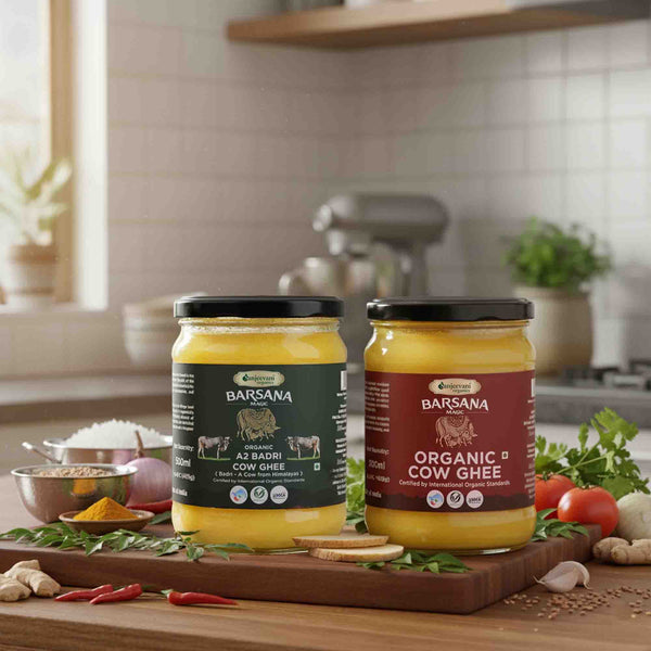Barsana Magic and Two jars of Organic Ghee on a kitchen counter with ingredients in the background.
