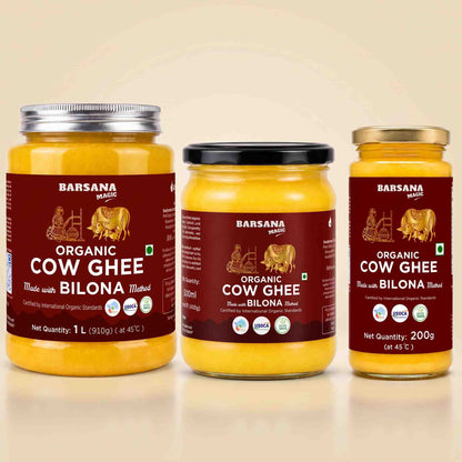 Barsana Magic and Three glass jars of Barsana Organic Cow Ghee arranged side by side on a light beige background. The left jar has a silver lid, the middle has a black lid, and the right has a gold lid.
