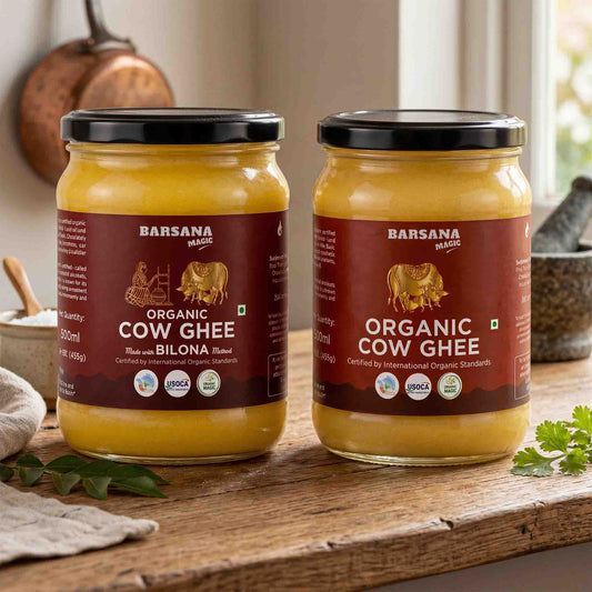 Barsana Magic and Two jars of Barsana Magic Organic Cow Ghee (Blue with Bilona) displayed on a rustic wooden table with a blurred kitchen background.