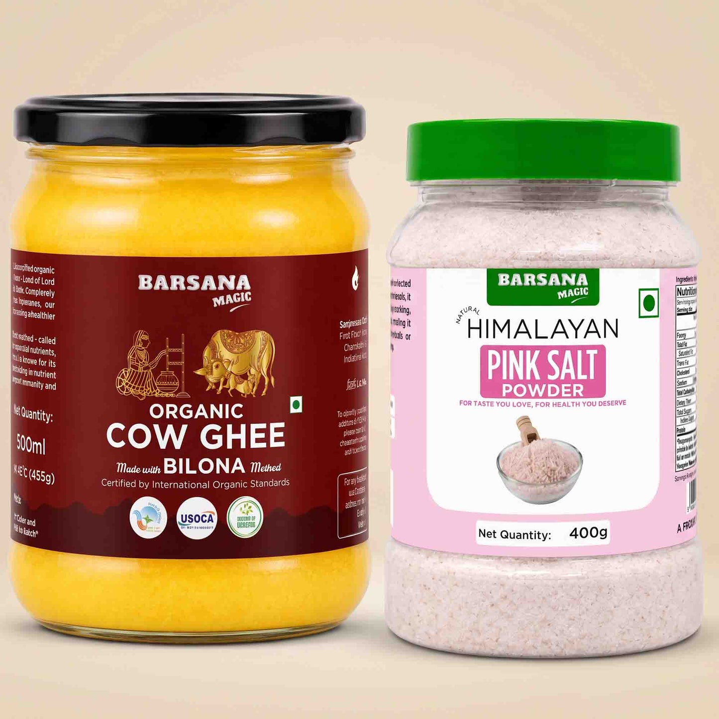 Barsana Magic and Two Barsana Magic products on a beige background: a large jar of Organic Cow Ghee with a black lid and dark red label, and a plastic jar of Himalayan Pink Salt powder with a green lid and pink label.