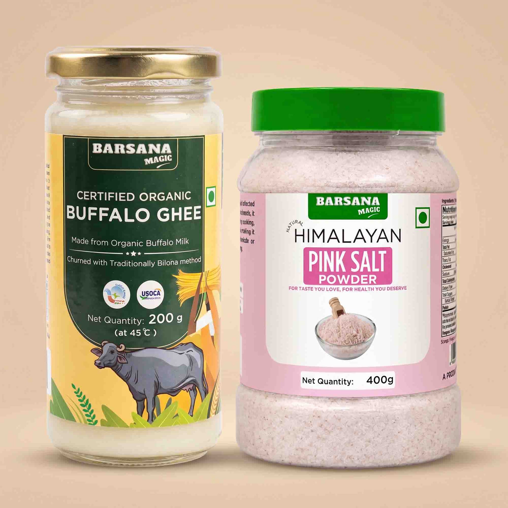 Barsana Magic and Two Barsana Magic products on a beige background: a glass jar of Certified Organic Buffalo Ghee with a gold lid and yellow-green label, and a plastic tub of Himalayan Pink Salt Powder with a green lid and pink label.