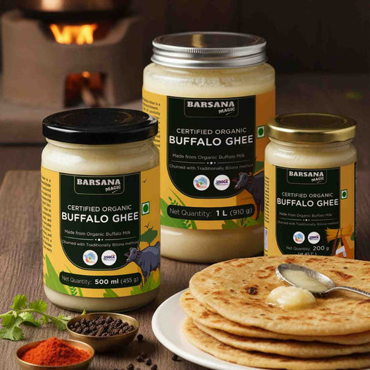 Barsana Magic and Jars of Buffalo Ghee with a plate of flatbread and spices on a wooden surface.