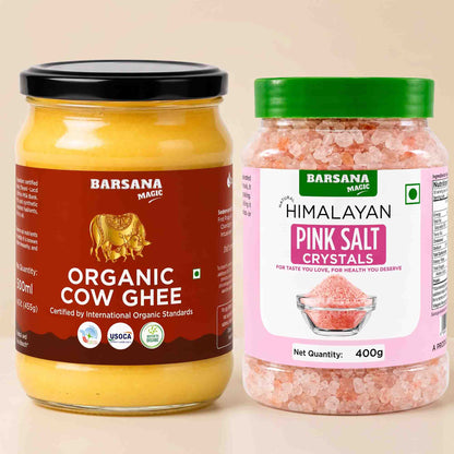 Barsana Magic and Two Barsana Magic products shown side by side on a light beige background: a glass jar of Organic Cow Ghee with a black lid and dark red label, and a plastic jar of Himalayan Pink Salt Crystals with a green lid and pink label.