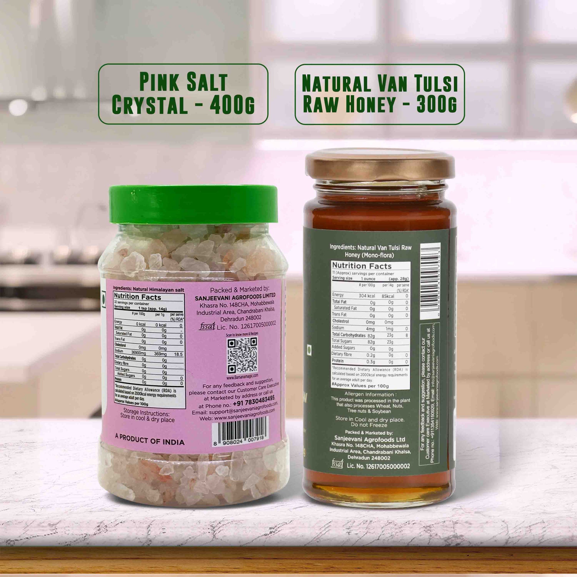 Barsana Magic and Two jars labeled 'Pink Salt Crystal' and 'Natural Van Tulsi Raw Honey' on a kitchen counter.