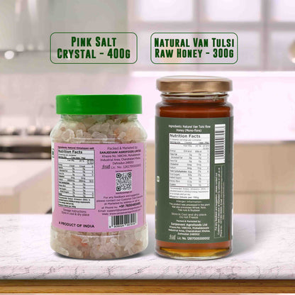 Barsana Magic and Two jars labeled 'Pink Salt Crystal' and 'Natural Van Tulsi Raw Honey' on a kitchen counter.