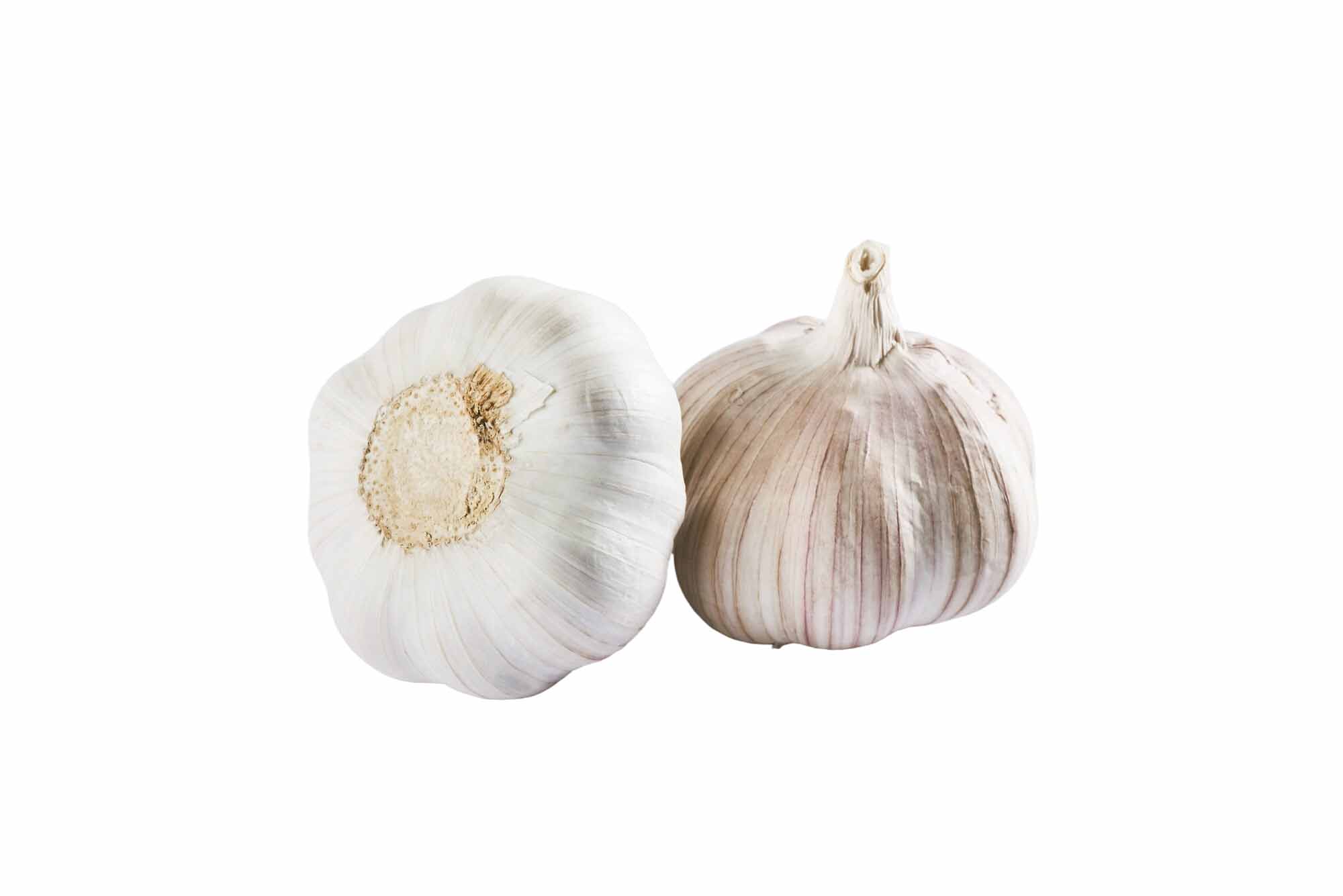 Barsana Magic and Two garlic bulbs on a white background