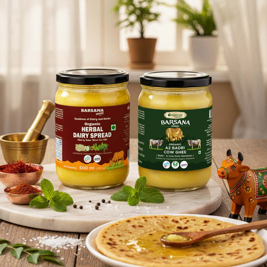 Barsana Magic and Two jars of Barsana organic dairy products on a wooden table with a plate of flatbread and spices.