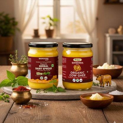 Barsana Magic and Two jars of Barsana Organic Cow Ghee on a wooden table with herbs and a small cow figurine.