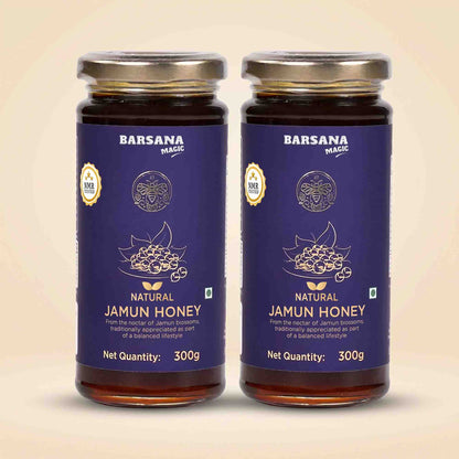 Barsana Magic and Two 300g glass jars of Barsana Magic Natural Jamun Honey, featuring dark purple labels with gold foil details and silver metal lids, set against a light beige background.
