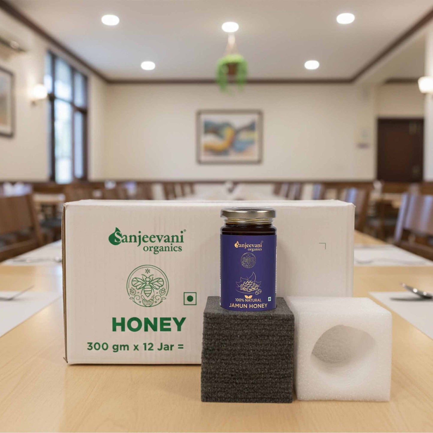 Barsana Magic and Organics honey jar on a stand with a box in the background