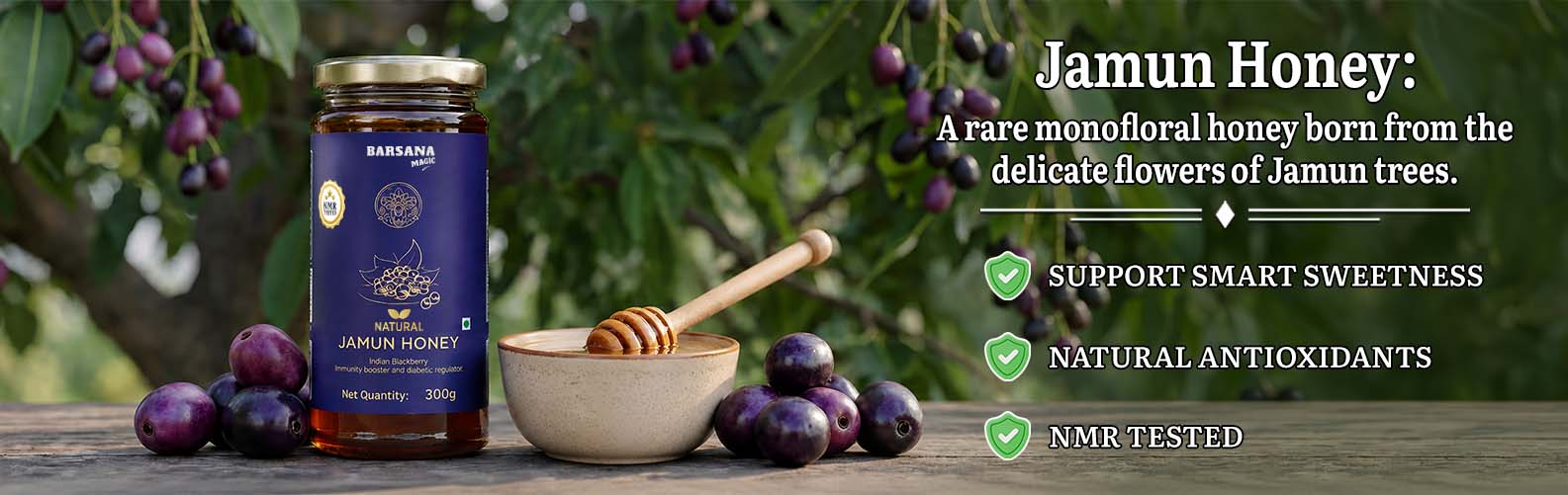 Barsana Magic and Bottle of Jamun honey with jamun fruits on a wooden table, surrounded by greenery.