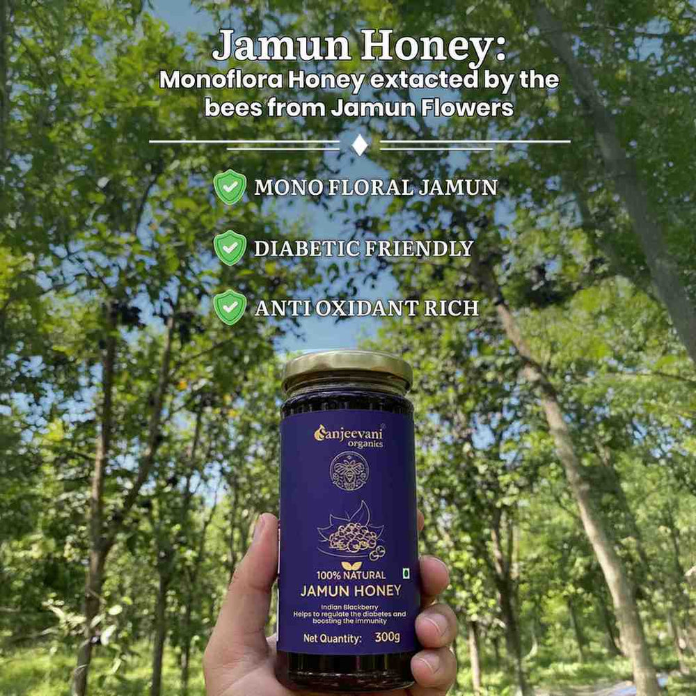 Barsana Magic and Hand holding a jar of Jamun Honey with forest background