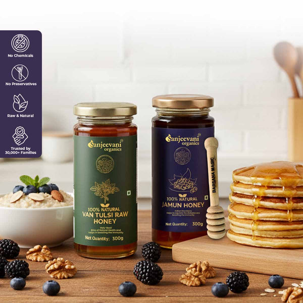Barsana Magic and Two jars of Gajeevani Organics honey with a stack of pancakes and breakfast items on a wooden table.