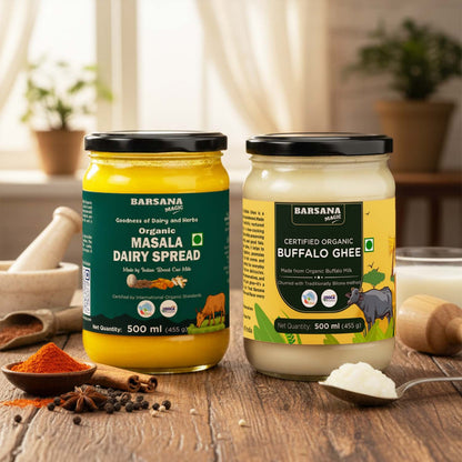 Barsana Magic and Two jars of Barsana Organic Dairy Spread on a wooden surface with spices and a spoon.