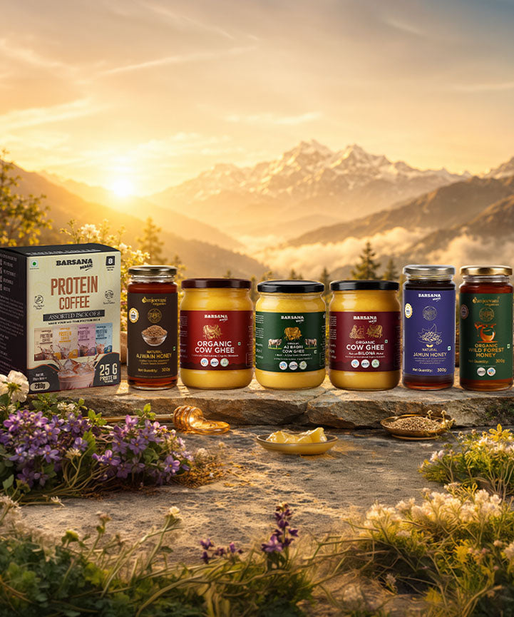 Barsana Magic and Banned products displayed against a mountainous landscape with a sunset.