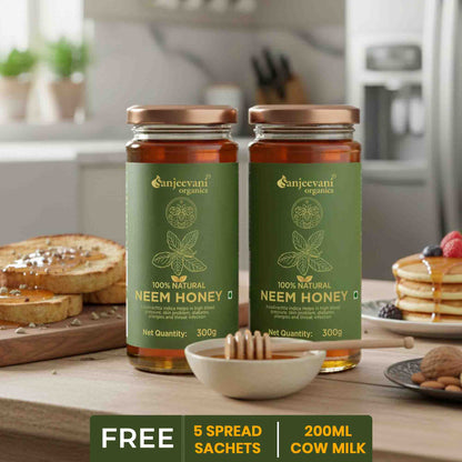 Barsana Magic and Two jars of Sanjeevani Neem Honey on a kitchen counter with breakfast items.