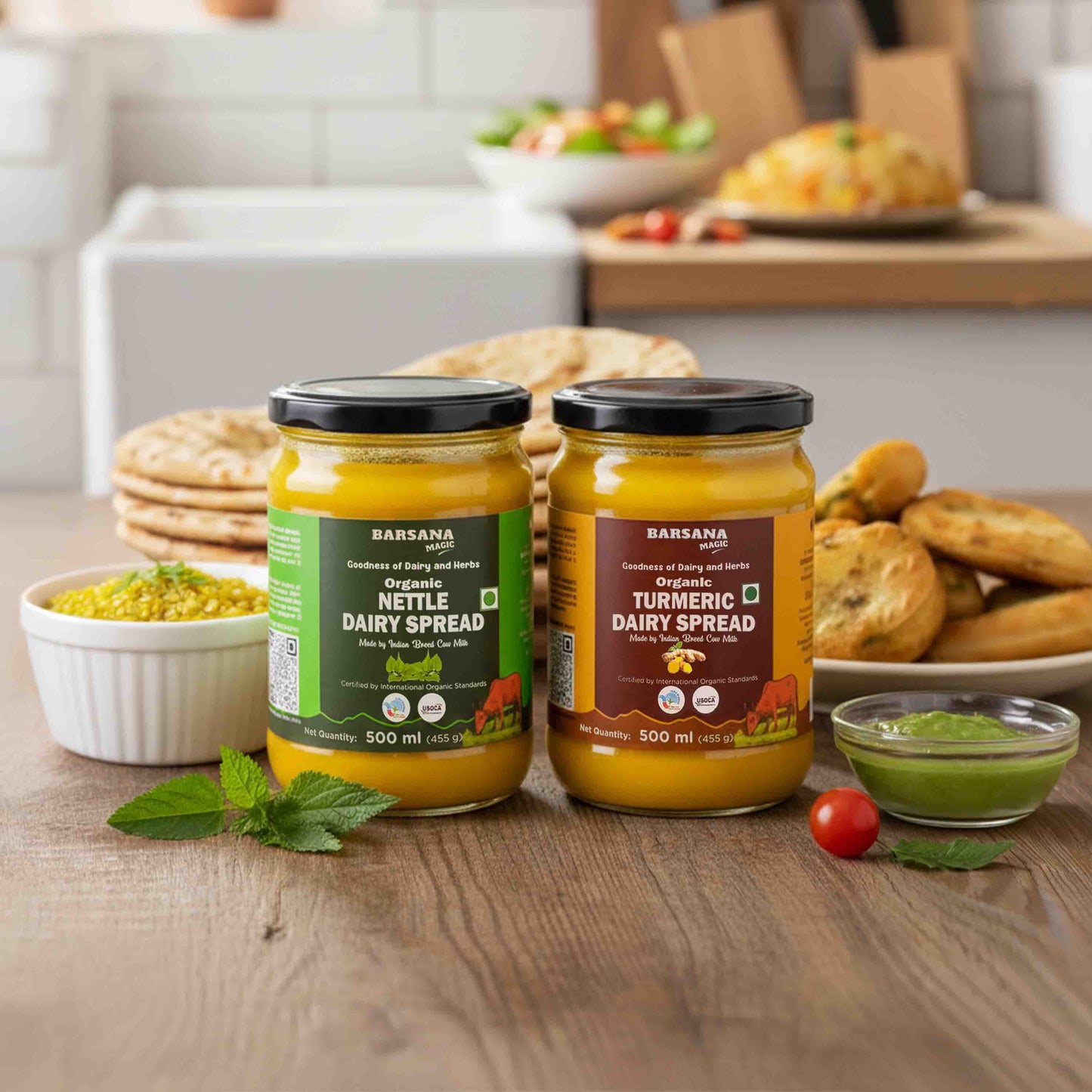 Barsana Magic and  Two jars of dairy spread on a wooden table with food items in the background.