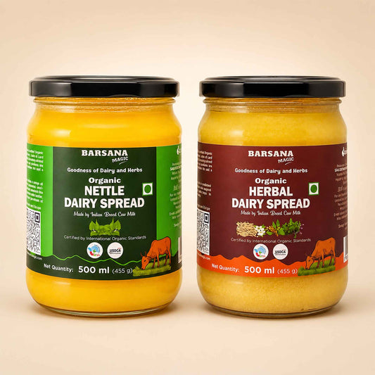 Barsana Magic and Two 500 ml jars of Barsana Organic spreads on a light beige background. The left jar contains Organic Nettle Dairy Spread with a green label, and the right jar contains Organic Herbal Dairy Spread with a dark red label.