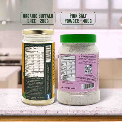 Barsana Magic and Two jars labeled 'Organic Buffalo Ghee' and 'Pink Salt Powder' on a kitchen counter.