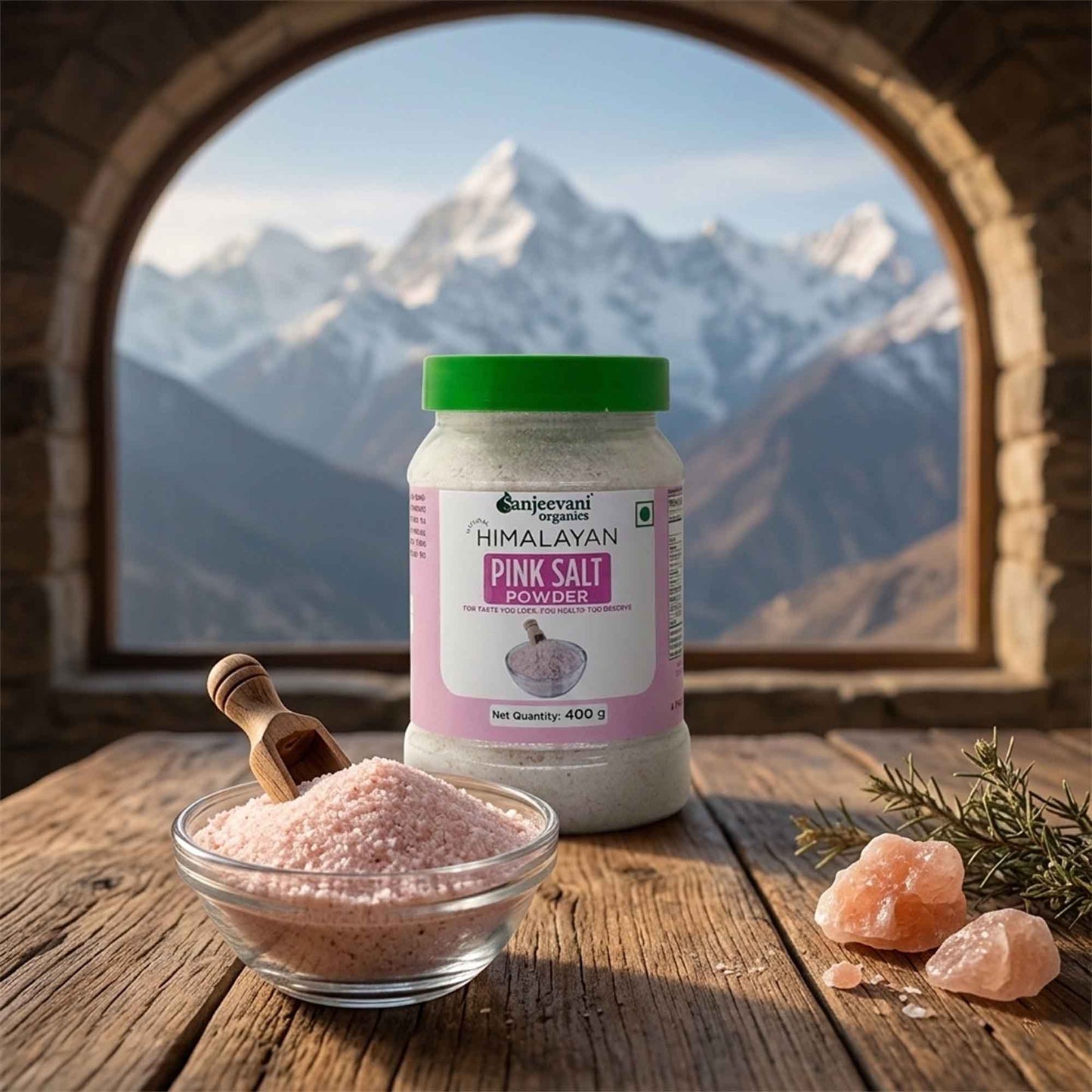 Barsana Magic and Himalayan Pink Salt Powder jar with a bowl of salt and pink salt crystals on a wooden surface with mountain view.