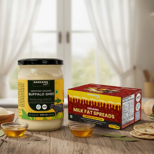 Barsana Magic and Jars of Barsana Organic Buffalo Ghee and Milk Fat Spreads on a wooden surface with a blurred background.