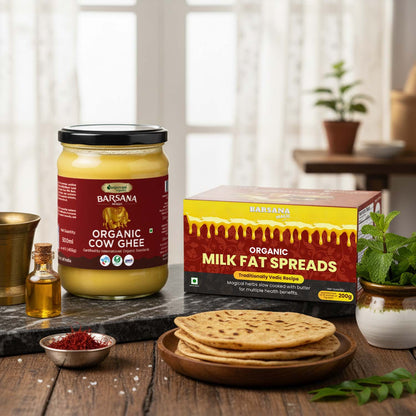 Barsana Magic and Jar of Barsana Organic Cow Ghee and packaging on a wooden table with flatbreads.