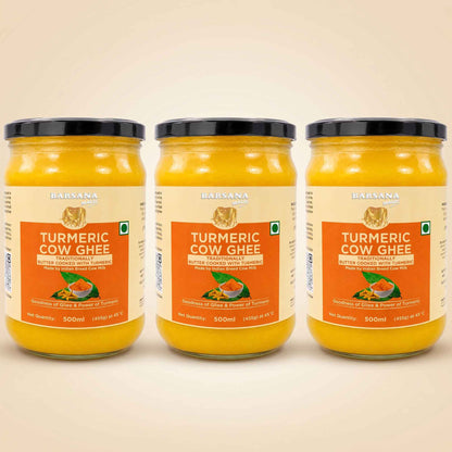 Barsana Magic and Three 500ml glass jars of Baisana Organic Turmeric Cow Ghee arranged side by side against a light beige background.