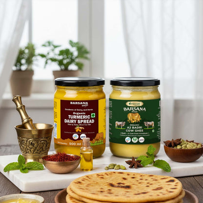 Barsana Magic and Two jars of Barsana dairy products on a table with flatbread and spices.