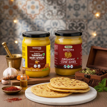 Barsana Magic and Two jars of Barsana dairy products on a wooden table with flatbreads and spices.