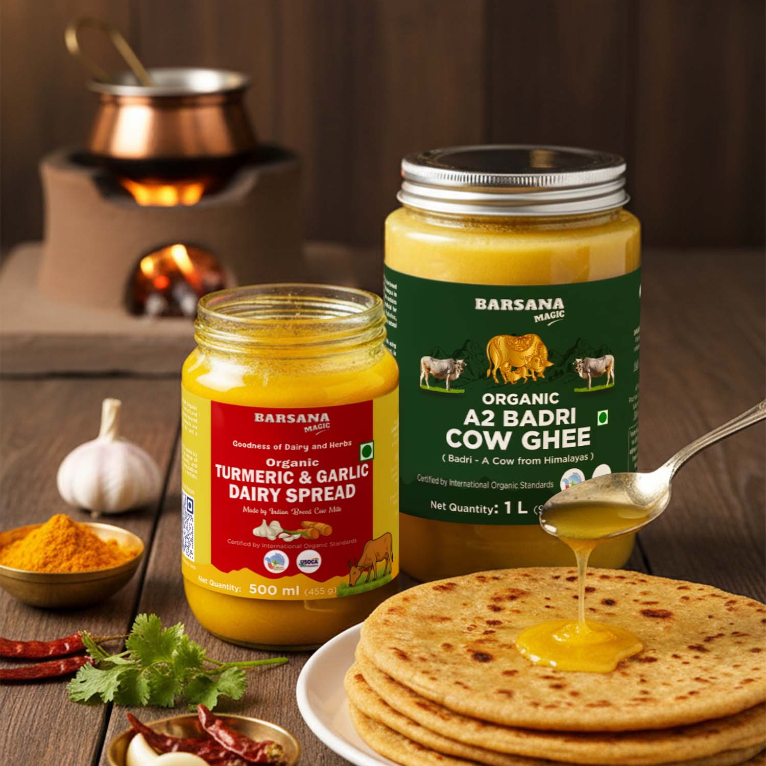 Barsana Magic and Two jars of dairy products with a plate of flatbreads and a spoonful of ghee on a wooden surface.