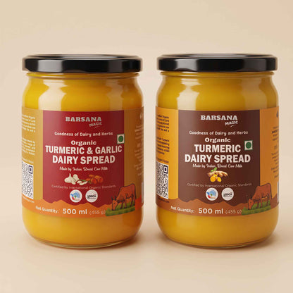 Barsana Magic and Two jars of Barsana Organic Turmeric & Garlic Dairy Spread on a warm beige background. The jars are filled with a thick yellow-orange spread and feature brown and red labels with black lids.