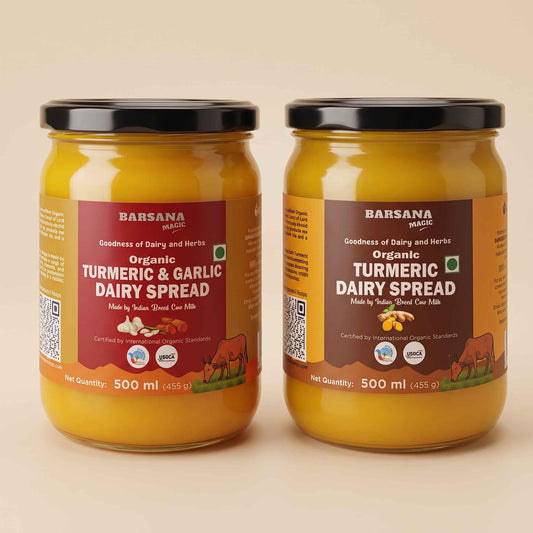Barsana Magic and Two jars of Barsana Organic Turmeric & Garlic Dairy Spread on a warm beige background. The jars are filled with a thick yellow-orange spread and feature brown and red labels with black lids.