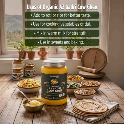 Barsana Magic and Jar of Organic A2 badri Cow Ghee on a wooden table with cooking utensils and food.