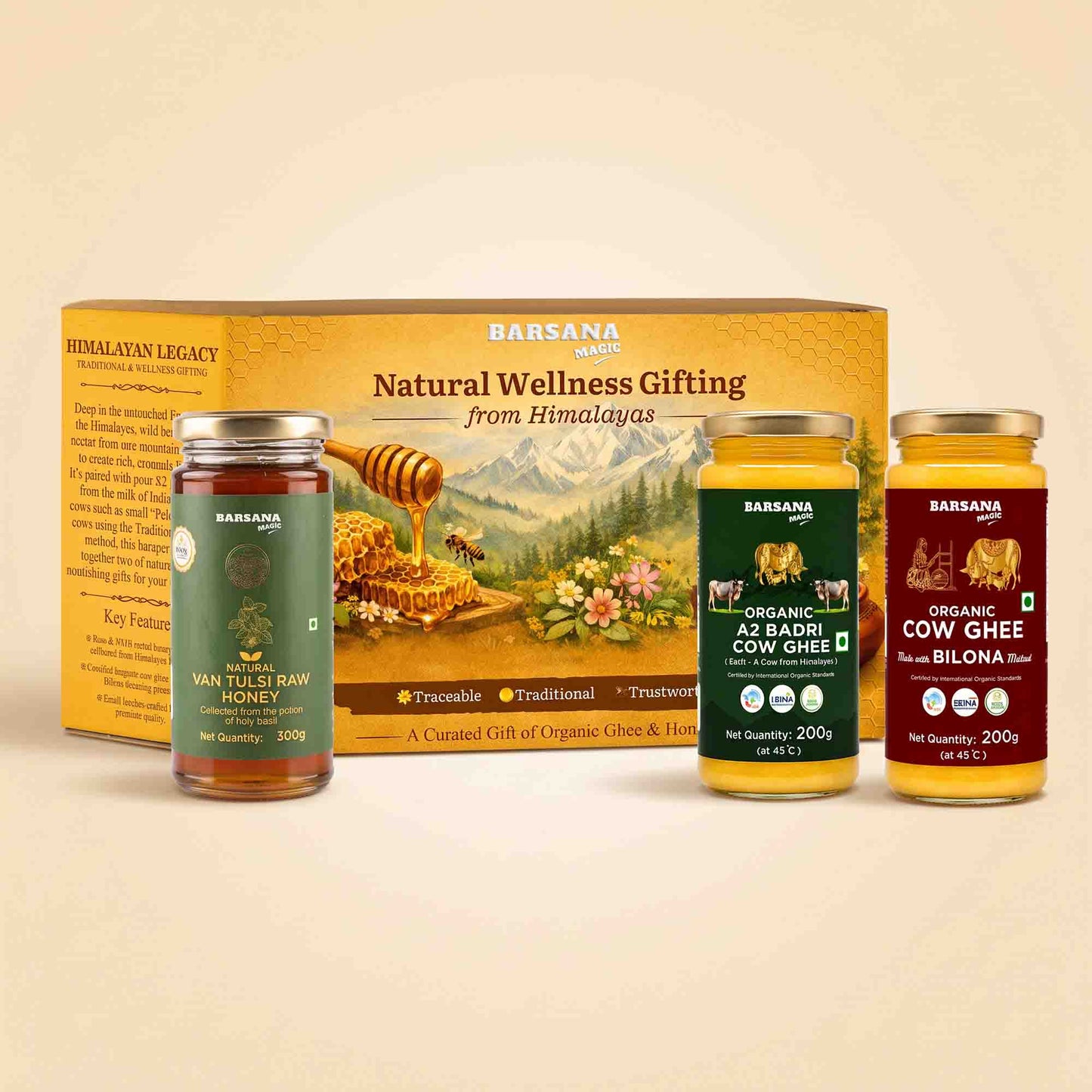 Barsana Magic and Natural Wellness Gifting set featuring a large yellow and green box behind three glass jars of honey, ghee, and butter: Man Tulsi Raw Honey, Organic A2 Radhi Cow Ghee, and Organic Butter of Bilona.