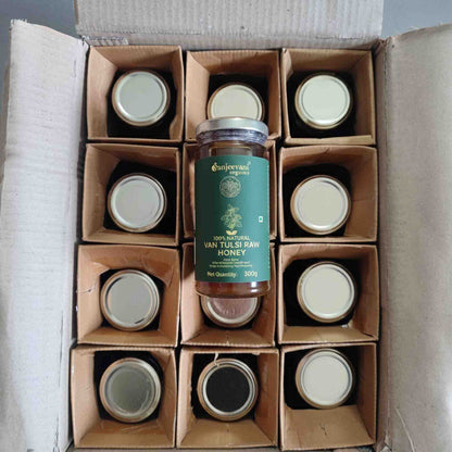 Barsana Magic and Box of honey jars with a central jar labeled 'Sunjeevani' on a gray background