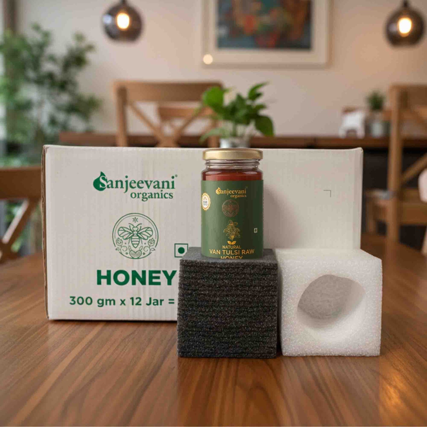 Barsana Magic and Jar of Sanjeevani honey on a wooden table with packaging in the background