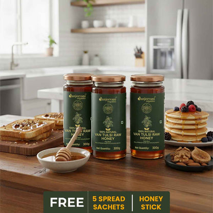 Barsana Magic and Three jars of Van Tulsii Raw Honey on a kitchen counter with pancakes and toast.