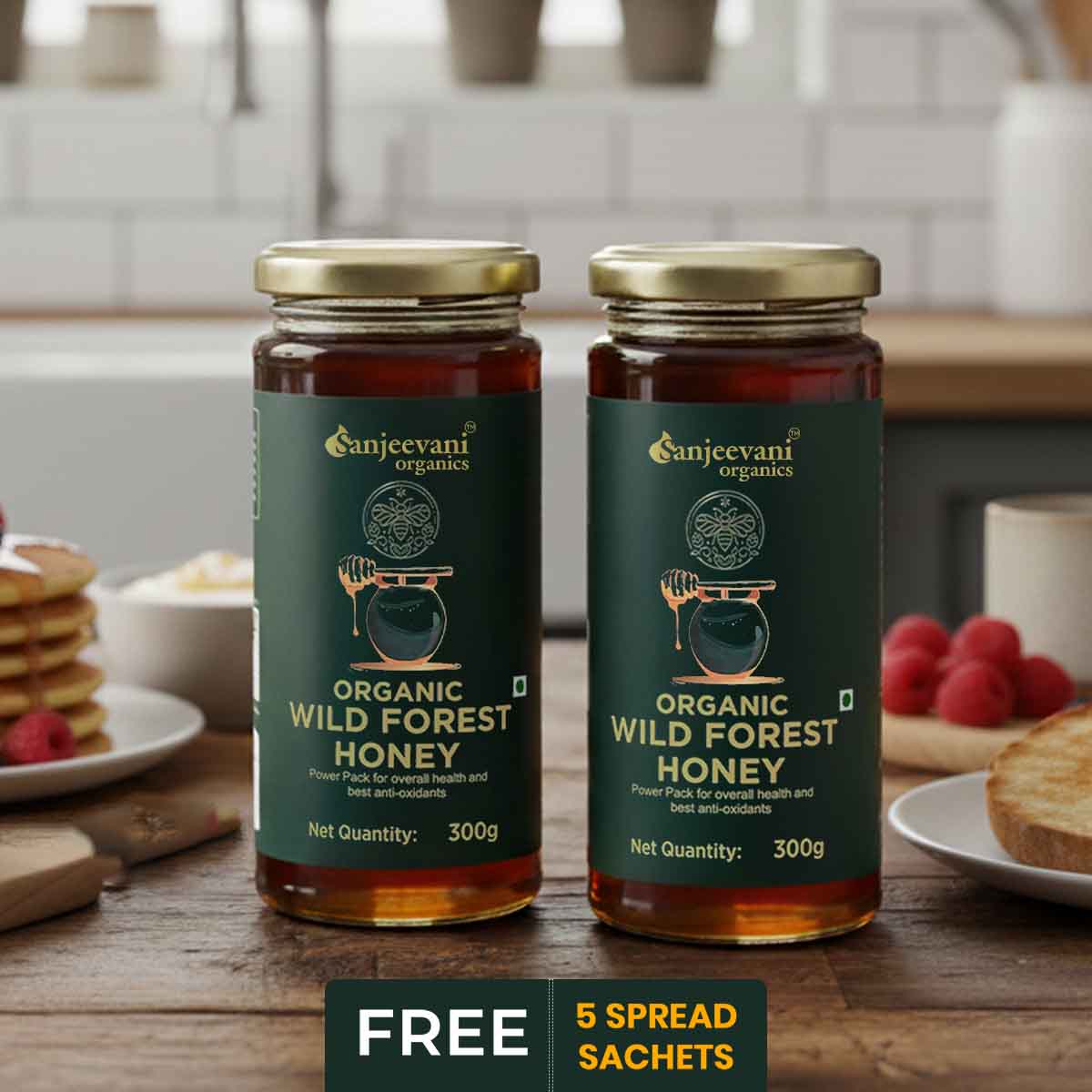 Barsana Magic and Two jars of Sanjeevani Organics Organic Wild Forest Honey on a kitchen counter with a plate of toast and berries.