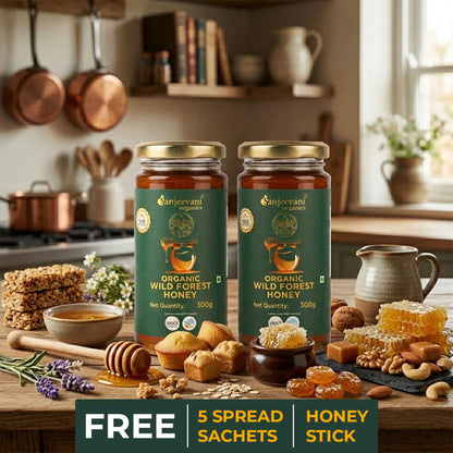 Barsana Magic and Two jars of Sanjeev Kapoor Organic Wild Forest Honey on a kitchen counter with various honey products and snacks.