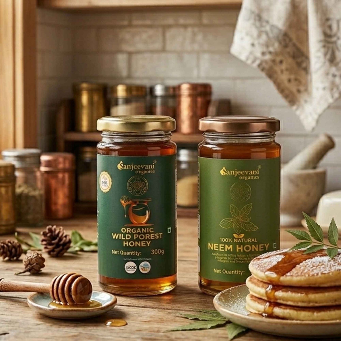 Barsana Magic and Two jars of honey from Sanjeevani Organics on a wooden table with pancakes and honey dipper.